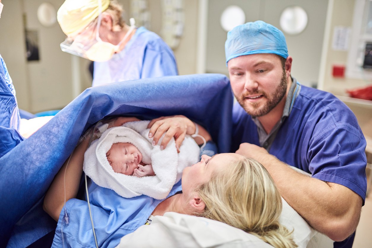 Baby right after birth with family